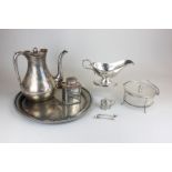 A silver plated coffee pot, sauce boat, tea caddy, tray, preserve pot, mustard and two mustard