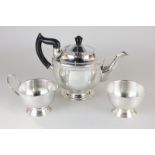 A Viners of Sheffield silver plated three piece tea set with embossed floral border