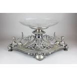 An Elkington & Co silver plated table centre, the boat shaped base mounted with griffins at each