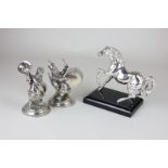 A pair of silver plated grotesque bandsmen and an Italian silver plated horse