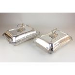 A pair of silver plated entree dishes and covers, rectangular form with cut corners and gadroon