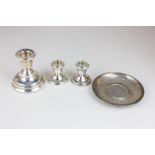 An Elizabeth II silver dwarf candlestick, together with a pair of miniature dwarf silver