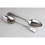 Two George III silver Old English pattern serving spoons, one monogrammed, maker Stephen Adams,