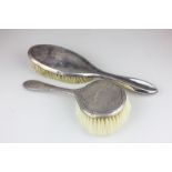 An Edward VII silver backed dressing table brush, Birmingham 1909, a silver plated dressing table