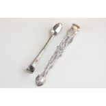 A pair of George III silver sugar tongs with pierced decoration and shell shaped terminals, engraved