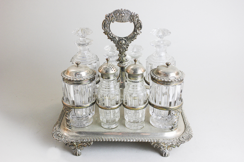 A George IV silver and cut glass eight bottle cruet set by William Barret II, London 1823, including