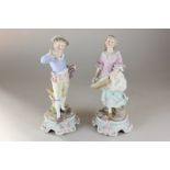 A pair of 19th century Dresden porcelain figures of a girl with a basket and a boy with a stick,