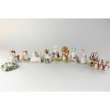 Eleven Beswick Beatrix Potter figurines, including Old Mr Brown (gold lettering), Timmy Willie