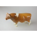 A Beswick porcelain Guernsey bull, Champion Sabrina's Sir Richmond 14th, model 1451, in tan and