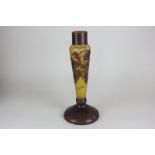 A cameo glass lamp base decorated with oak leaves and acorns, in tones of brown, marked Gallé, 31cm