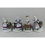 A set of four Continental porcelain figures of 18th century style women, all seated, gardening,