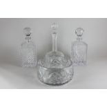 Two cut glass spirit decanters, a wine decanter and a fruit bowl