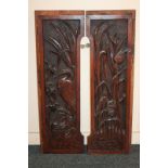 A pair of panels, deeply carved with a heron and other birds in the reeds (a/f), 28cm by 91cm