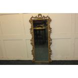 A rectangular wall mirror with pierced scrolling foliate gilt frame, 90cm high