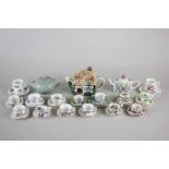 A collection of miniature porcelain teacups, saucers and teapots, by Coalport, Hammesley, Shelley