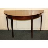 A mahogany demi-lune side table on square tapered legs, 124cm