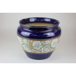 A Royal Doulton Slater's pottery jardiniere with central floral gilt design on blue ground, 23cm