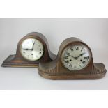 Two Edwardian oak mantel clocks, Napoleon's hat form, one with silverised dial with Roman