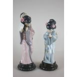 Two Lladro porcelain figures of Japanese girls in kimonos, one with a fan, both with flowers in