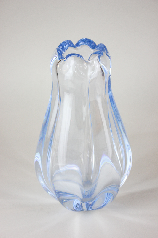 An Orrefors Swedish glass vase in the form of a flower head in translucent blue, 26cm high, marks to