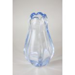 An Orrefors Swedish glass vase in the form of a flower head in translucent blue, 26cm high, marks to