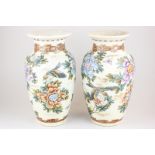 A near pair of Japanese Satsuma vases, baluster shape, decorated with birds and blossom, marks to