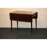 A 19th century mahogany Pembroke table with single drawer and opposing dummy drawer, on square