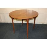 A demi-lune tea table, the folding circular top with central starburst and segmented inlay, on