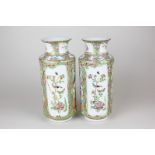 A near pair of Chinese famille rose porcelain vases, each with two scenes of an interior (a/f -