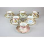 A Harlequin group of six Victorian Doulton coffee cans and saucers, each finely decorated with