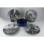 A Royal Doulton blue glazed fruit bowl, 19cm, and four Royal Doulton pictorial plates with view of