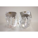 A pair of Boda, Sweden glass book ends in the form of heads, by Eric Hoglund, with paper labels,