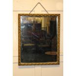 A rectangular wall mirror with decorated gilt frame, 45cm by 55cm