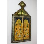 A Middle Eastern black lacquered wall mirror with twin panel doors, highly decorated with flowers