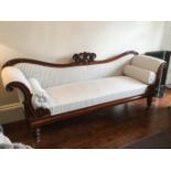 A William IV carved mahogany scroll end settee, upholstered in grey and white ticking stripes, the