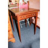 An Edwardian inlaid mahogany envelope card table, with four section fold out top, on square