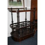 A Victorian style rosewood Canterbury whatnot with shelf above, music racks and drawer at base, on