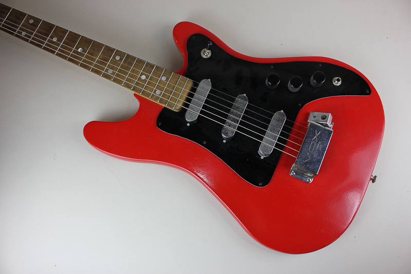 A Vox electric guitar in red and black, and a Vox Valvetronix AD30VT amplifier, guitar length 91.