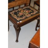 Early 20th cent. Oak piano stool with floral woolwork decorated top on cabriole supports.