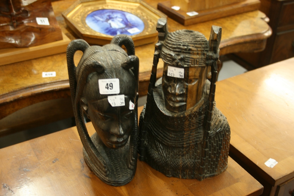 Tribal art: Hardwood carved West African figural bust of a male and female.