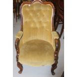 19th cent. Mahogany framed button backed elbow chair with a turned front supporting.