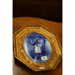 20th cent. Reproduction porcelain plaque of children in a gilt octagonal frame. 13½" x 11".
