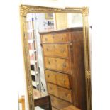 20th cent. Gilt framed wall hanging mirror with mirrored glass insets in a frame. 65ins. x 33ins.