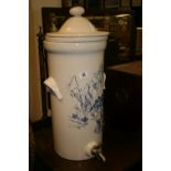 20th cent. Ceramic water dispenser, mountain stream study in a blue to the front. 23ins. high with