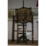 19th cent. Mahogany pole screen, turned column, carved tripod supports the screen with classical