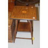 Edwardian rosewood two tier table on square tapering supports.