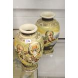 Oriental: Early 20th cent. Japanese Satsuma ovoid vases decorated with figures. 12ins.