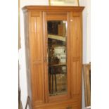 20th cent. Satinwood wardrobe, single mirror door with drawer beneath.