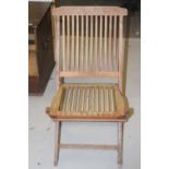 20th cent. Teak garden fold-up chairs. (8).