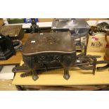 Late 19th early 20th cent. Rural bygones: Iron meat spit and a cast iron kettle stand.